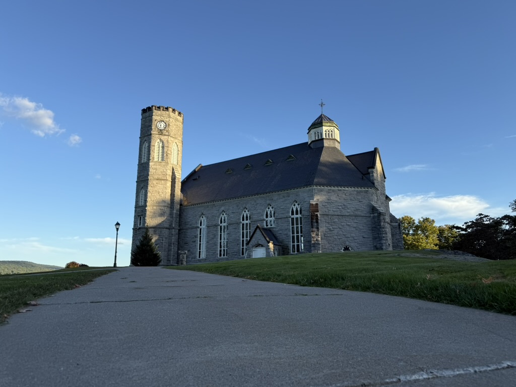 Stone chapel in late afternoon sunlight